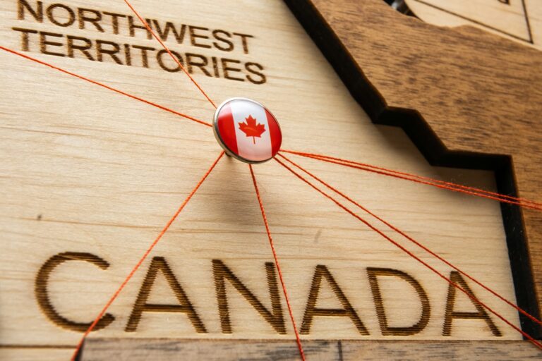 Canada flag on the pin with red thread showed the paths on the wooden map.