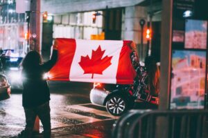 People holding Canadian flag